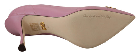 Pink leather heart-shaped DEVOTION heels by Dolce & Gabbana, showing elegant pumps with a stylish design and pointed toe.