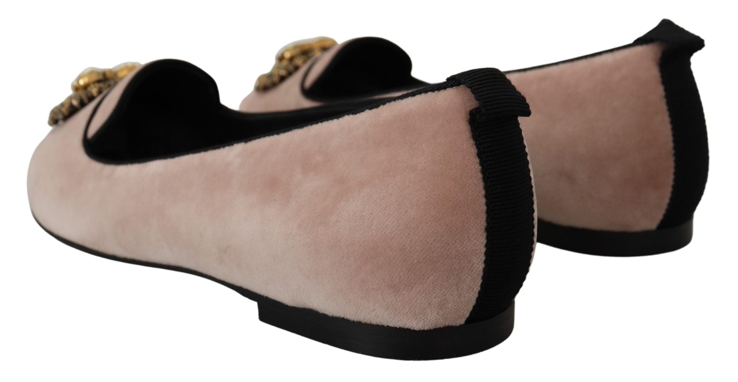 Pink velvet slip-on loafers by Dolce & Gabbana featuring a sleek, stylish flat shoe design with a smooth finish.