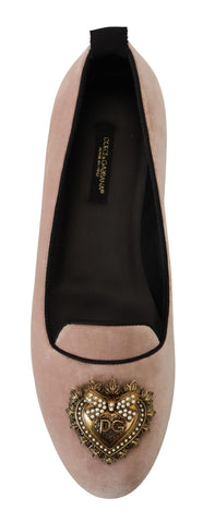 Pink velvet slip-on loafers from Dolce & Gabbana, featuring a sleek flat shoe design with a smooth, luxurious finish.