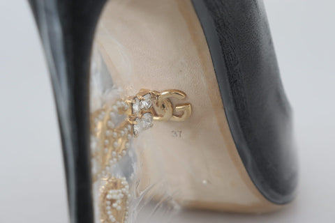 Dolce & Gabbana black leather heel pumps with plastic wrapping, stylish women's footwear for formal or evening wear.