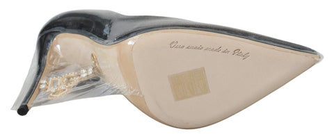 Black leather heel pumps by Dolce & Gabbana with plastic wrapping, stylish and elegant footwear for women.