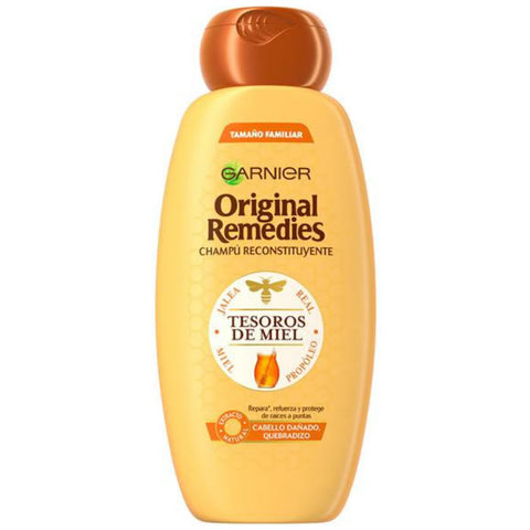 Garnier Honey Treasures Shampoo bottle from Jag Couture London with 600ml capacity, featuring honey and natural remedies ingredients.
