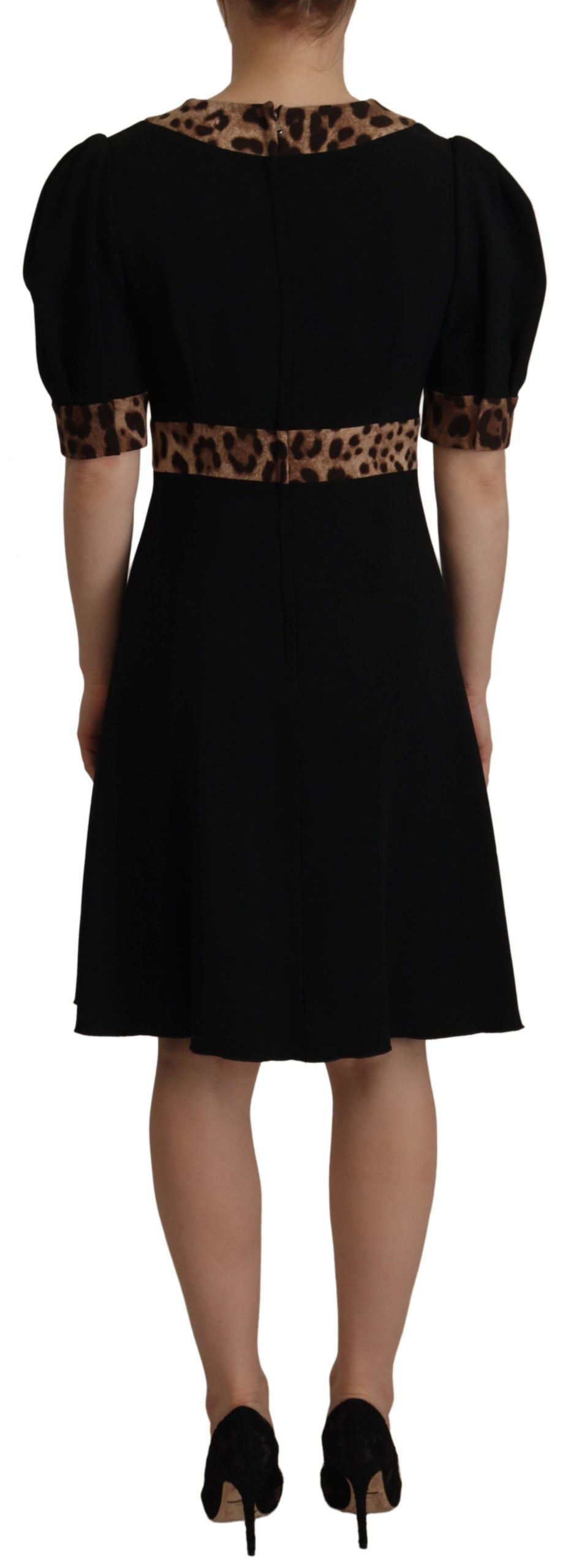 Black leopard print A-line knee-length dress by Dolce & Gabbana, featuring a fitted bodice and elegant skirt.
