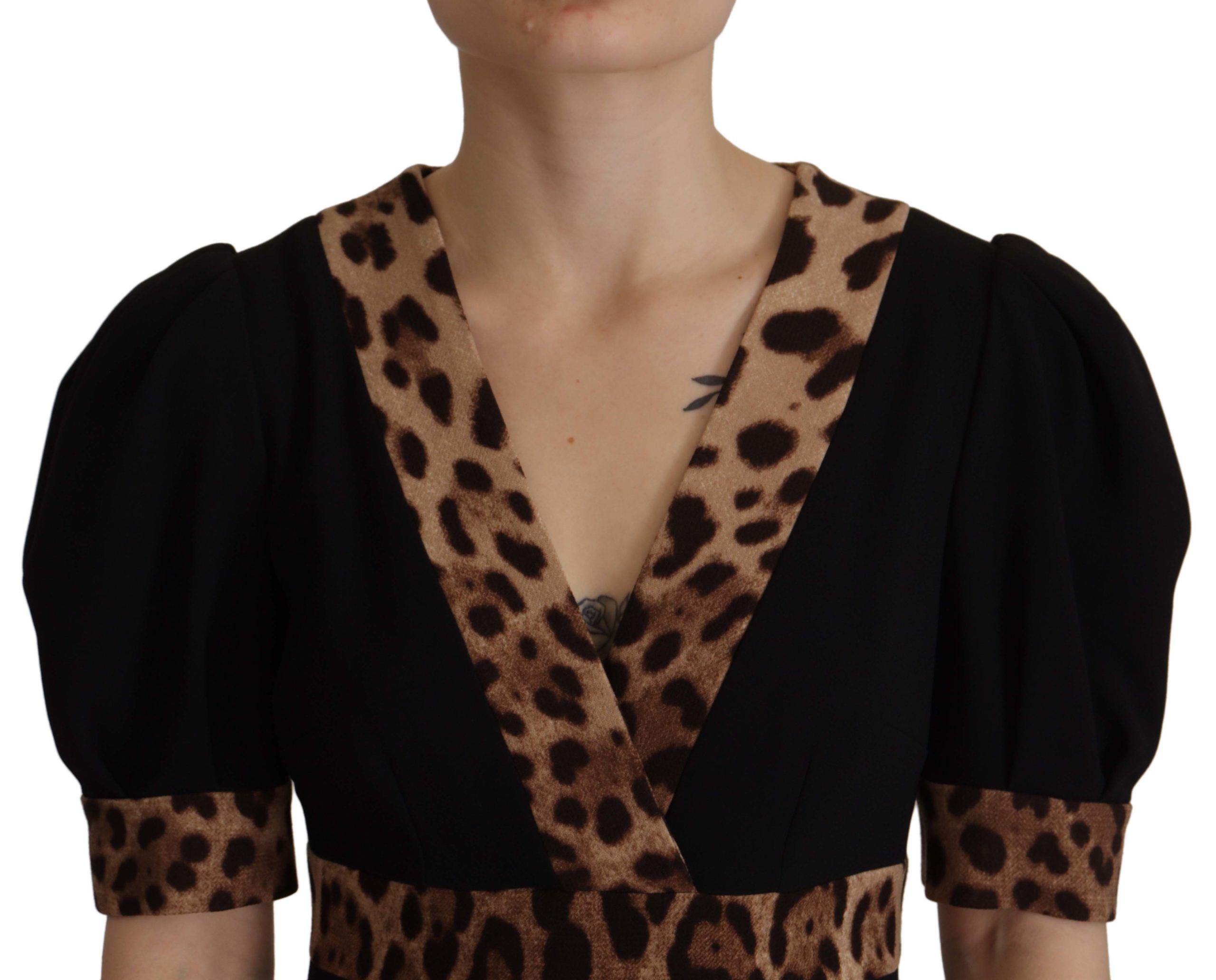 Black leopard print Dolce & Gabbana A-line knee-length dress displayed on a mannequin.