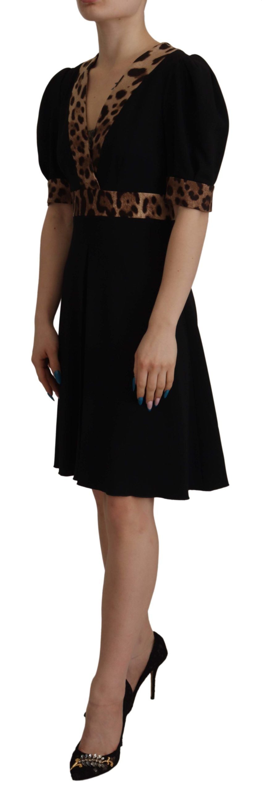 Black leopard print Dolce & Gabbana A-line knee-length dress with short sleeves and fitted waist.