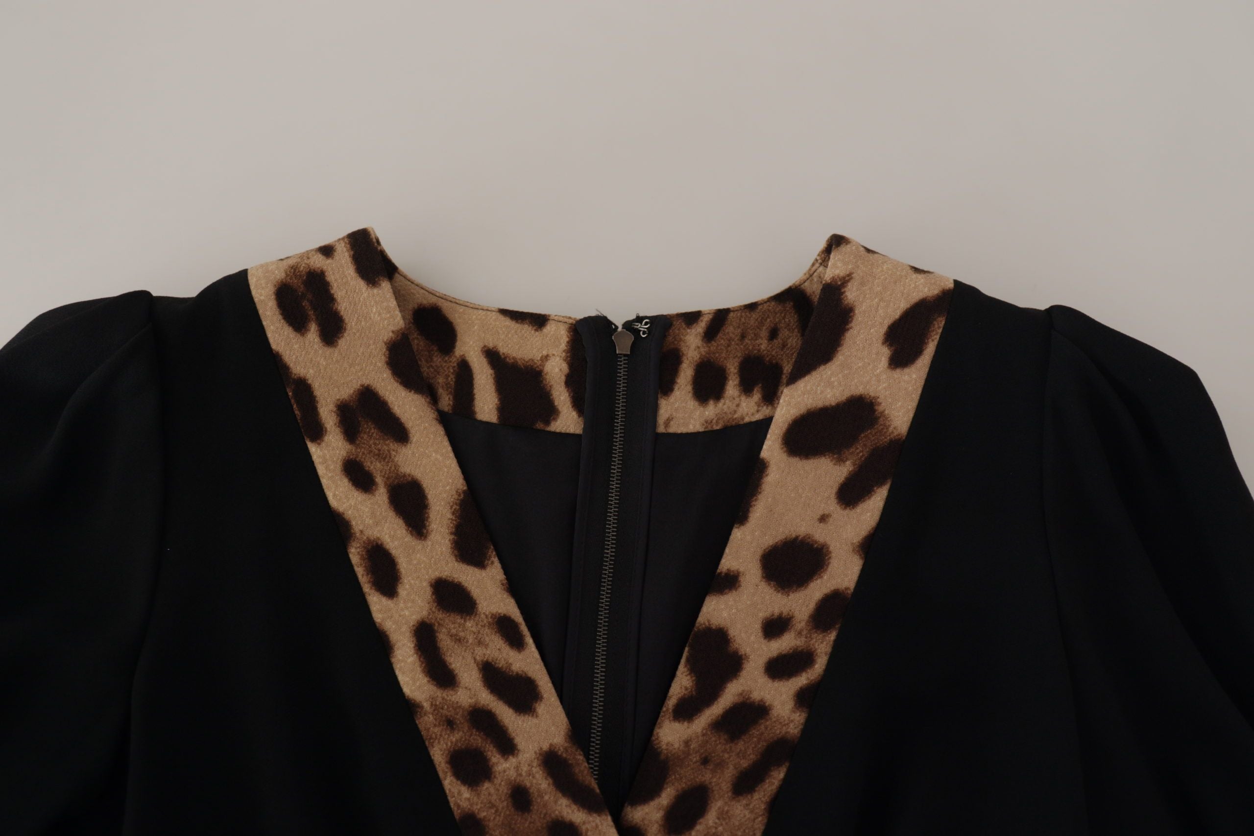 Black leopard print A-line knee-length dress by Dolce & Gabbana, featuring a fitted bodice and flowing skirt.