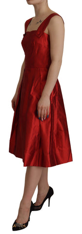Red Dolce & Gabbana A-line pleated satin silk dress with a fitted bodice and flowing skirt, showcased from a front view.