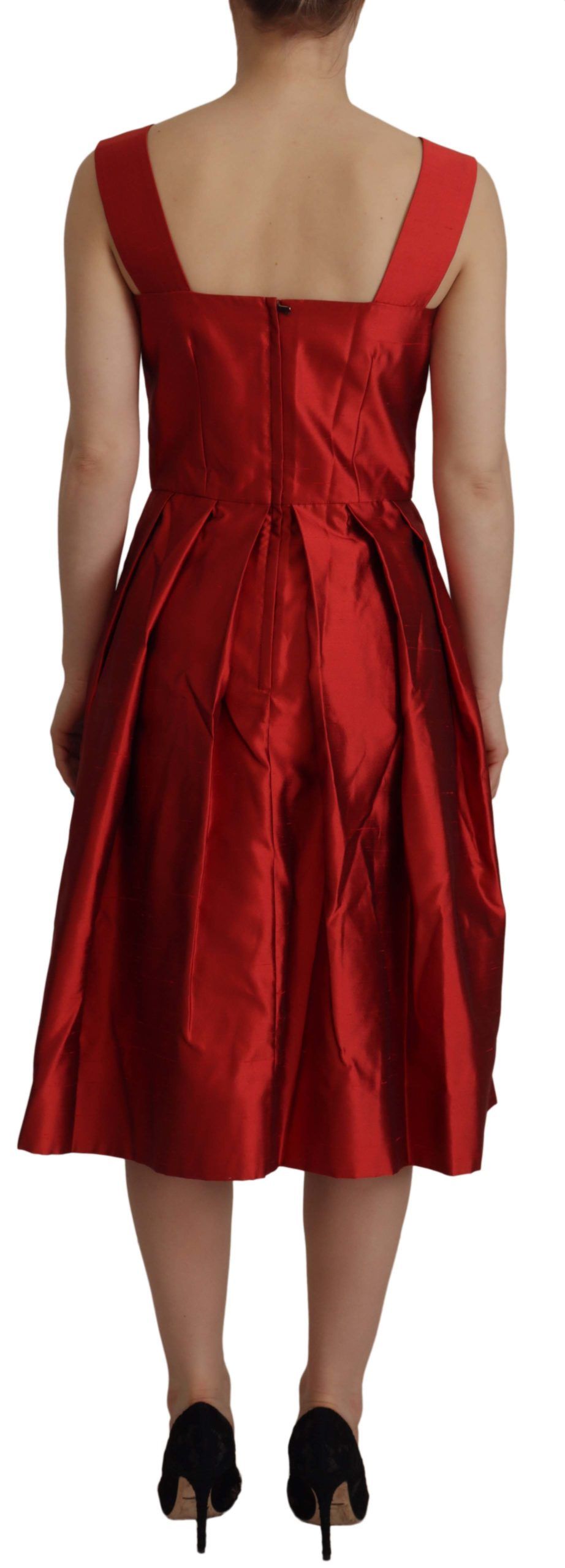 Red Dolce & Gabbana A-line pleated satin silk dress displayed on a mannequin with a flowing skirt and elegant design.