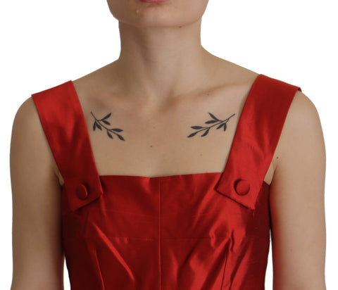 Red Dolce & Gabbana satin silk A-line pleated dress displayed on a mannequin. Elegant evening wear with flowing pleats and shiny fabric.
