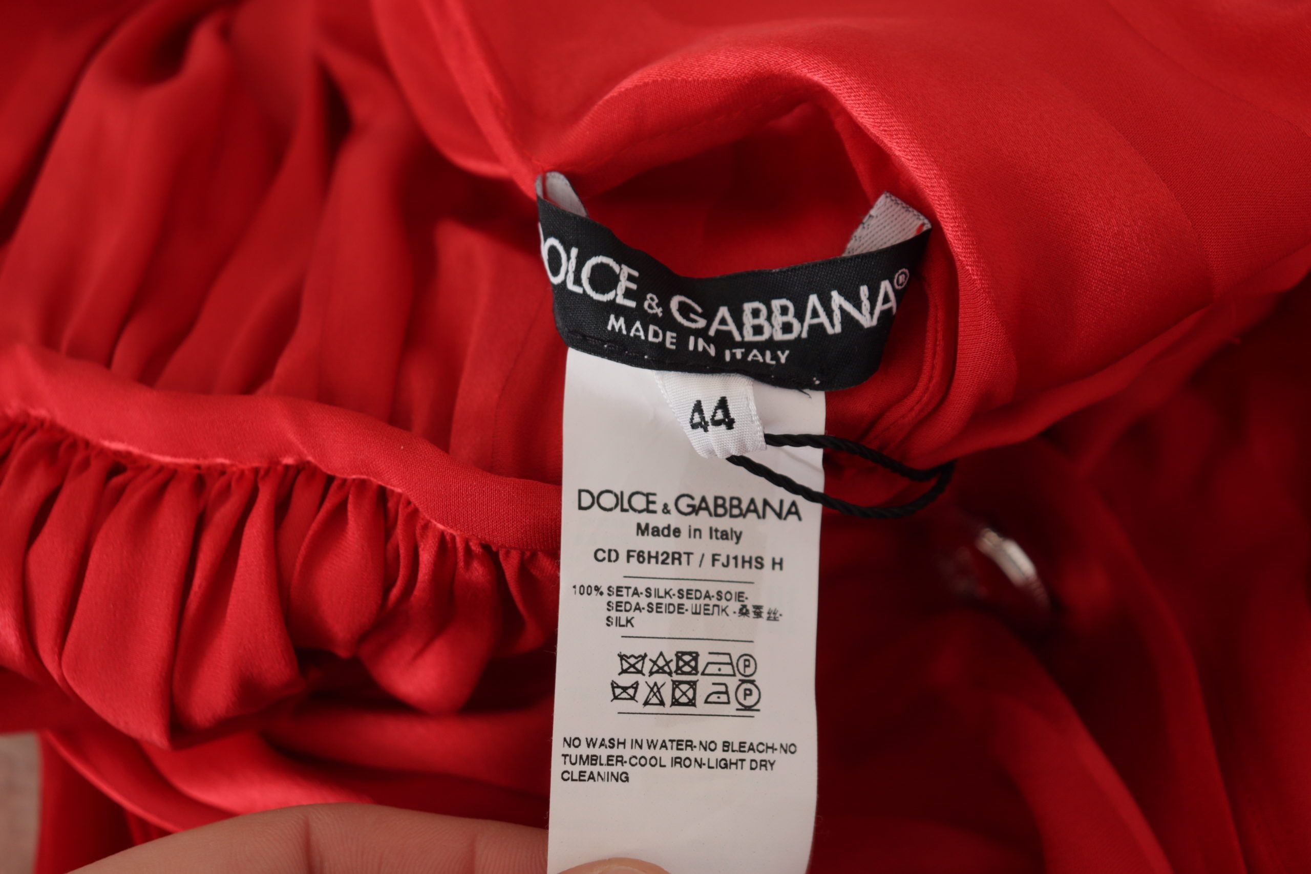 Red satin midi dress with button-down front and belted waist by Dolce & Gabbana, featuring a luxurious silk finish.