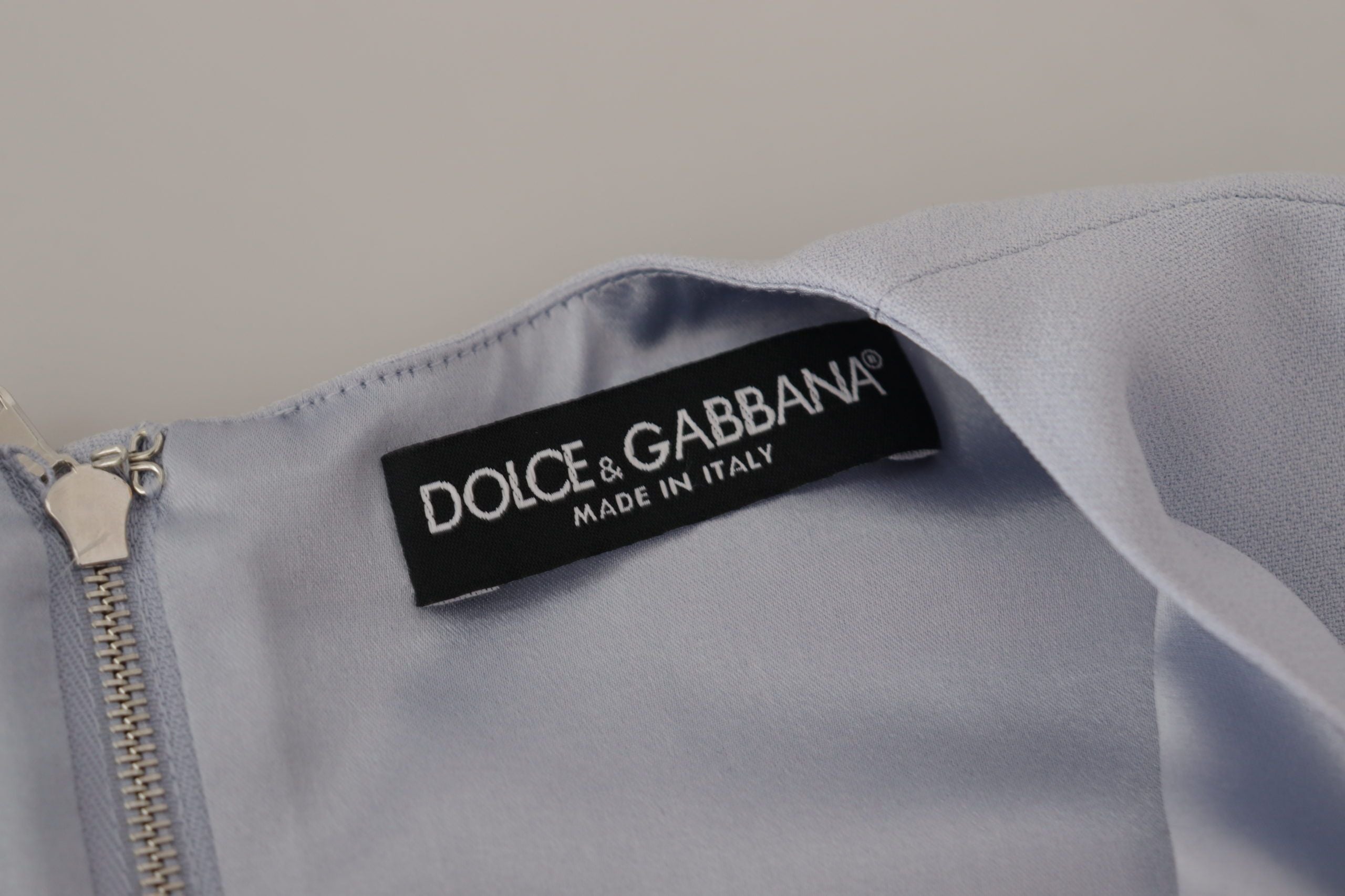 Blue floral applique midi viscose dress by Dolce & Gabbana, featuring a flowing silhouette with vibrant floral embroidery.