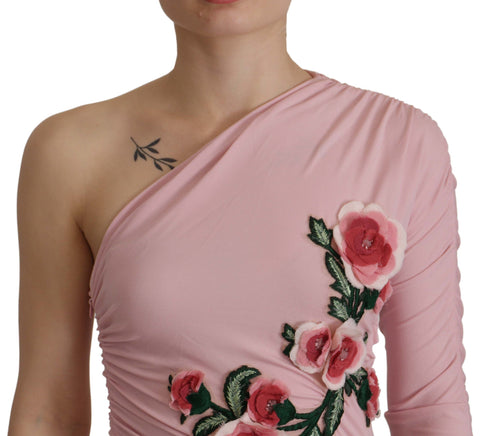 Pink flower-embellished one-shoulder dress by Dolce & Gabbana, featuring floral details and elegant design.