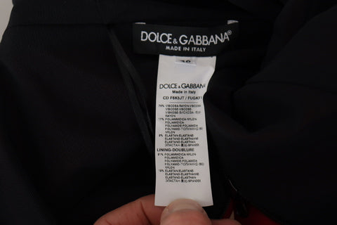 Red Dolce & Gabbana sweetheart neck bodycon midi dress displayed on a mannequin, showcasing its fitted silhouette and elegant design.