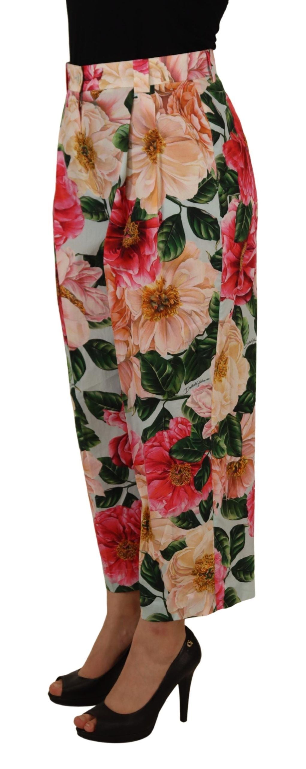 Multicolor flora printed high waist cropped trousers from Dolce & Gabbana, featuring a vibrant floral pattern and tailored fit.