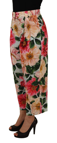 Multicolor flora printed high waist cropped trousers from Dolce & Gabbana, featuring a vibrant floral pattern and tailored fit.
