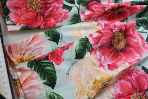 Multicolor floral printed high waist cropped trousers by Dolce & Gabbana, showing vibrant floral pattern and tailored fit.