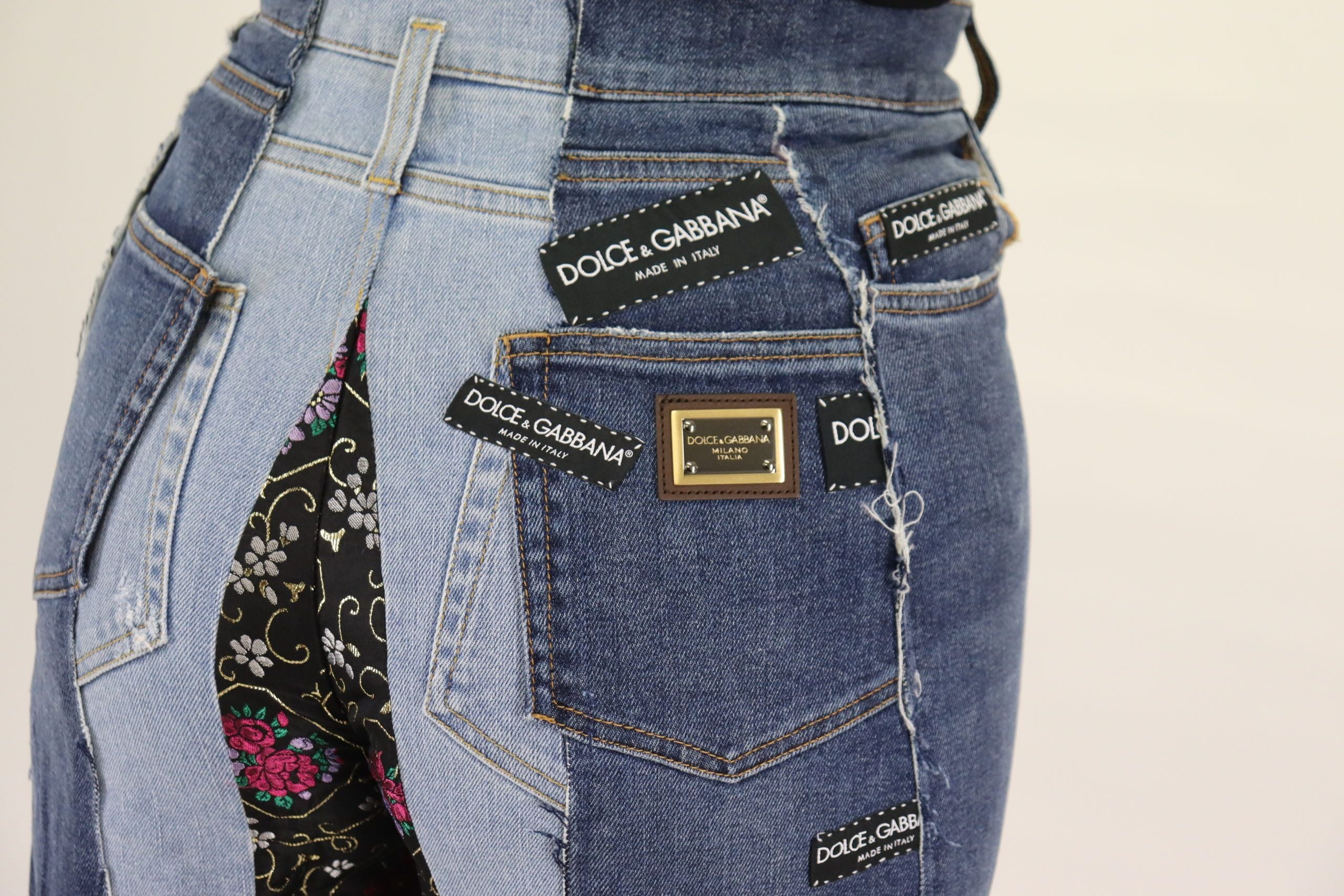 Multicolor patchwork wide-leg denim pants by Dolce & Gabbana, featuring vibrant fabric patches and a relaxed fit.