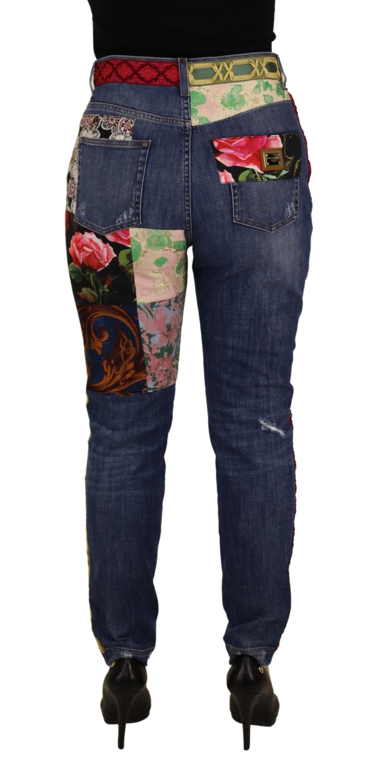 Blue patchwork high waist denim jeans by Dolce & Gabbana, showcasing stylish design and fitted silhouette.