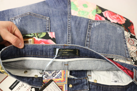Blue patchwork high waist denim jeans by Dolce & Gabbana with a fitted silhouette and stylish patchwork design.