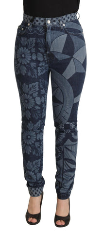 Blue floral high waist skinny denim jeans by Dolce & Gabbana, close-up of fitted jeans with floral pattern and high-rise waist.