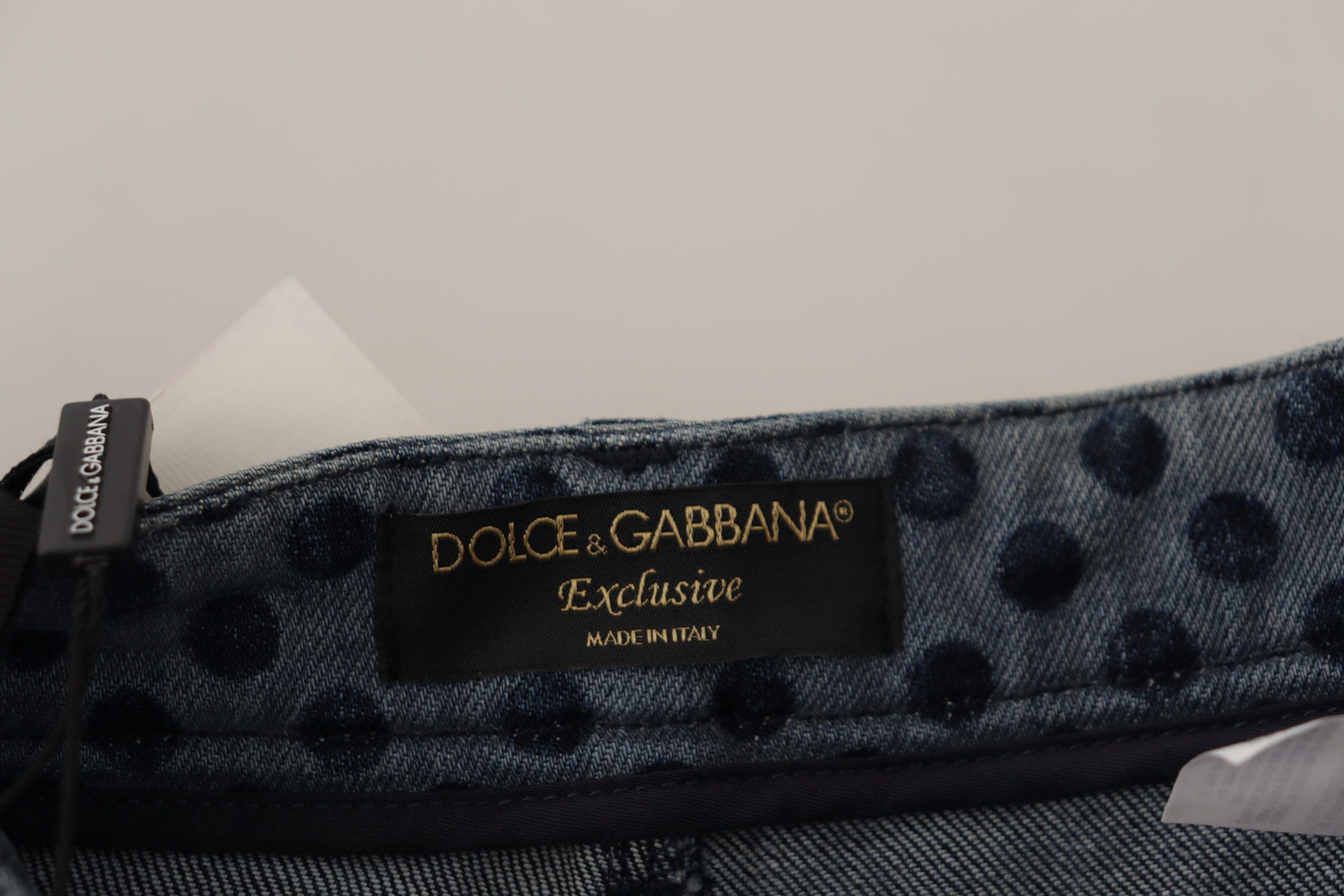 Blue floral high waist skinny denim jeans by Dolce & Gabbana, showing detailed floral print and fitted high-rise design.