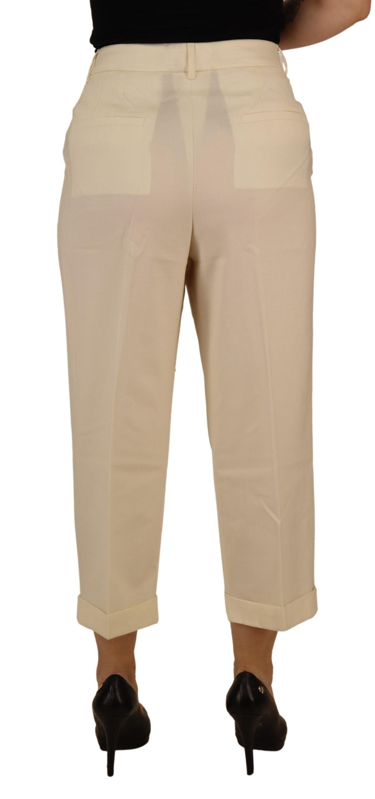 Ivory high waist cropped trousers with folded hem by Dolce & Gabbana, showcasing a stylish and tailored fit.