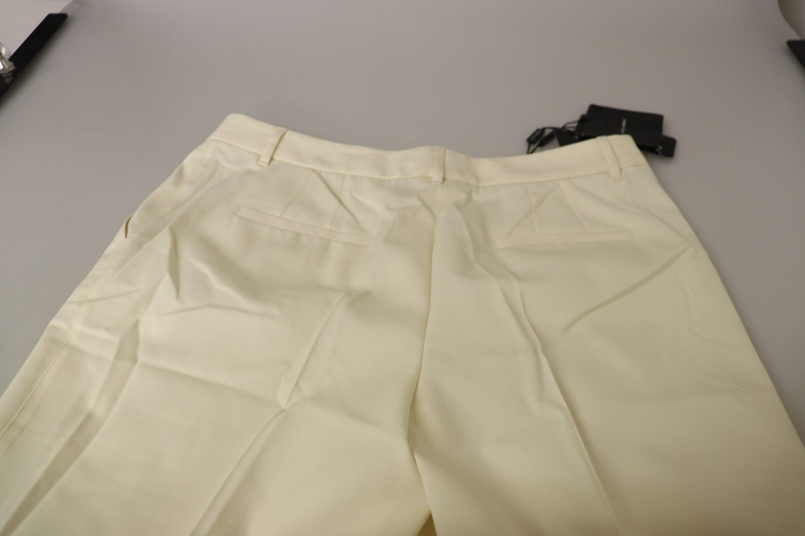 Ivory high waist cropped trousers with folded hem by Dolce & Gabbana, showcasing a stylish and tailored design.