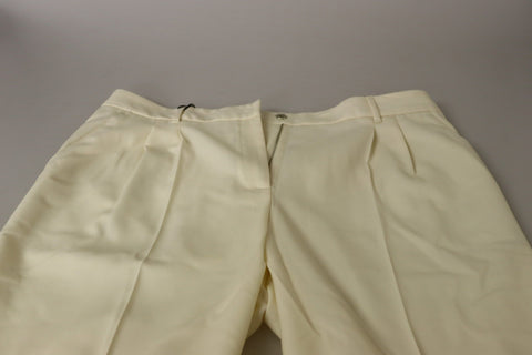 Ivory high-waist cropped trousers with folded hem by Dolce & Gabbana, displayed on a plain background.