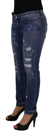 Blue washed cotton skinny denim jeans by Dolce & Gabbana with low waist fit, showcased on a hanger against a white background.