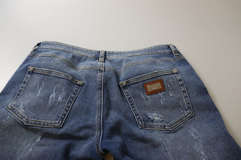 Blue washed cotton skinny low waist denim jeans by Dolce & Gabbana displayed on a hanger.