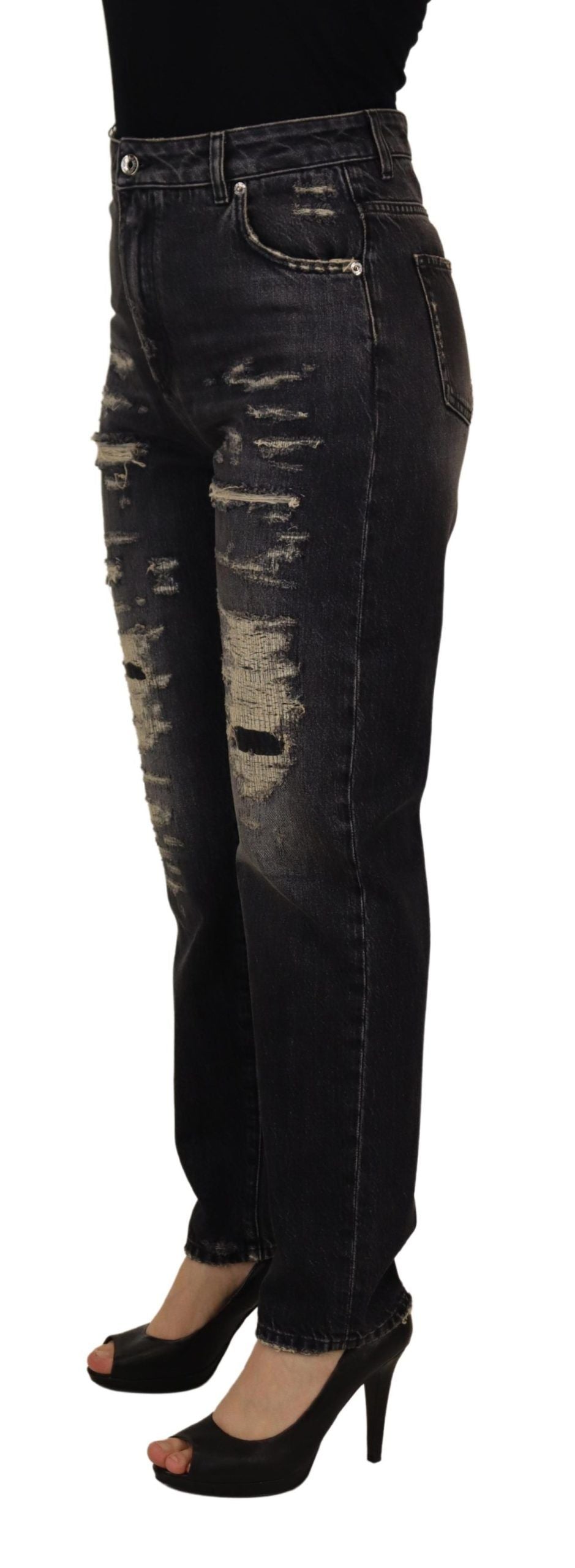 Black washed tattered high-waist denim jeans by Dolce & Gabbana, showcasing distressed details and classic high-rise fit.