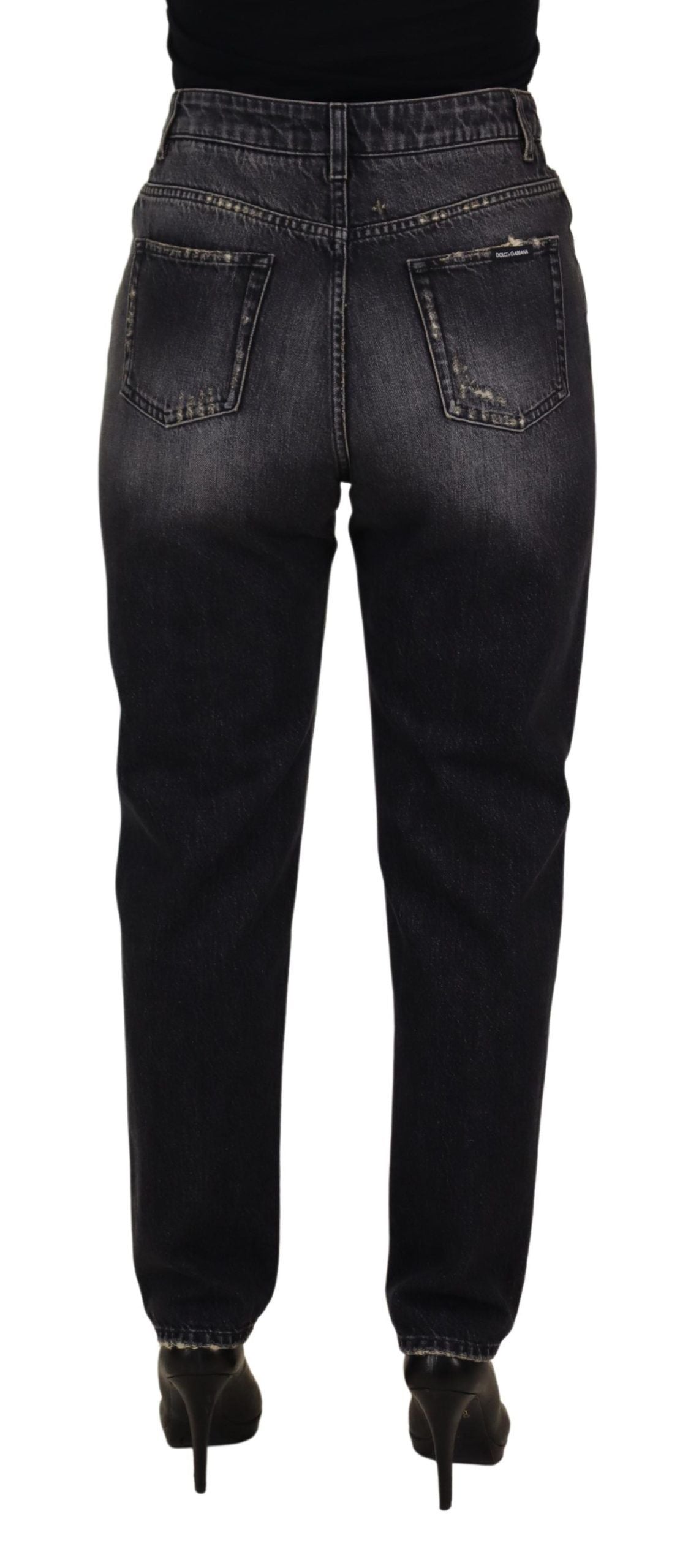 Black washed tattered high waist denim jeans by Dolce & Gabbana, showing distressed details and classic high-rise fit.
