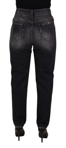 Black washed tattered high waist denim jeans by Dolce & Gabbana, showing distressed details and classic high-rise fit.