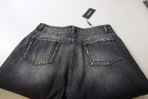 Black washed tattered high waist denim jeans from Dolce & Gabbana, featuring distressed details and a classic high-rise fit.