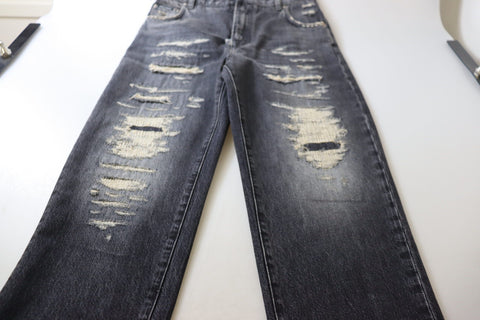 Black washed tattered high-waist denim jeans by Dolce & Gabbana, showcasing distressed details and classic high-rise fit.