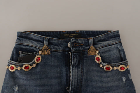 Blue denim jeans with crystal embellishments, stylish Dolce & Gabbana pants showcasing intricate detailing and a modern fit.