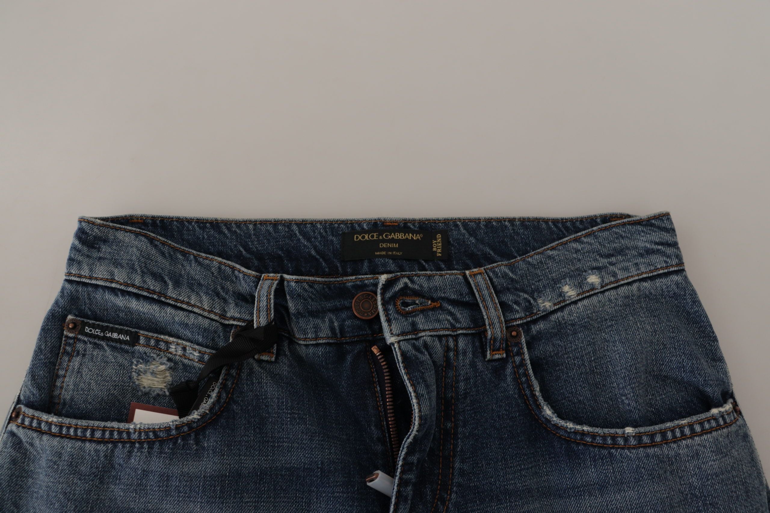 Blue denim jeans with Baroque heart logo patch from Dolce & Gabbana, stylish casual pants with embroidered details.