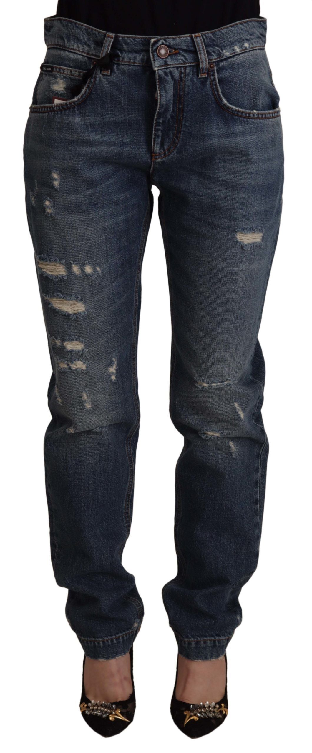 Blue denim jeans by Dolce & Gabbana featuring a baroque heart logo patch on the front.
