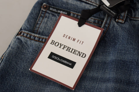 Blue denim jeans with Baroque heart logo patch from Dolce & Gabbana, featuring stylish details and classic denim texture.