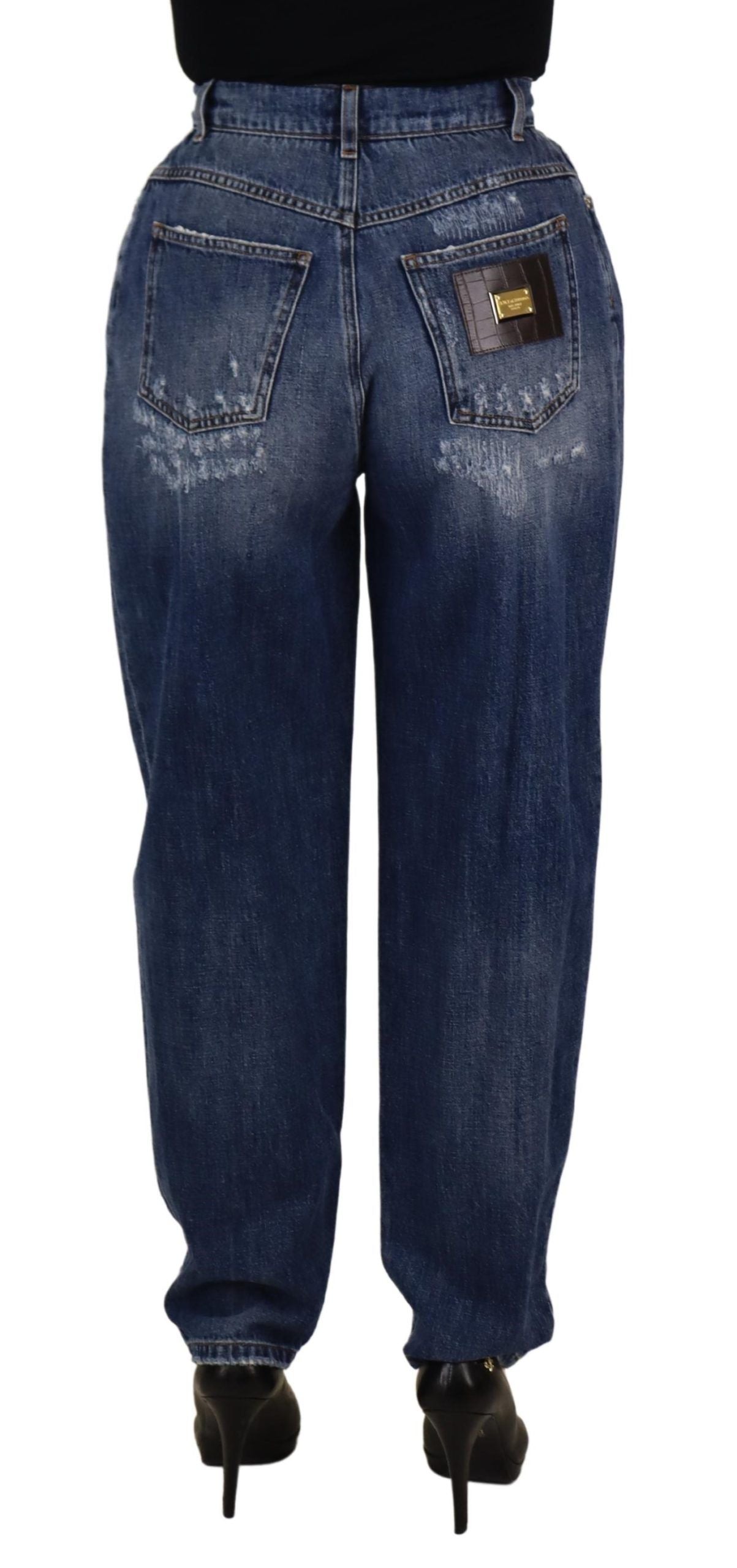 Blue washed high waist loose fit pants by Dolce & Gabbana, showing relaxed fit and denim texture on a plain background.
