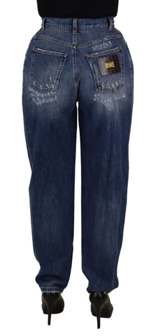 Blue washed high waist loose fit pants by Dolce & Gabbana, showing relaxed fit and denim texture on a plain background.