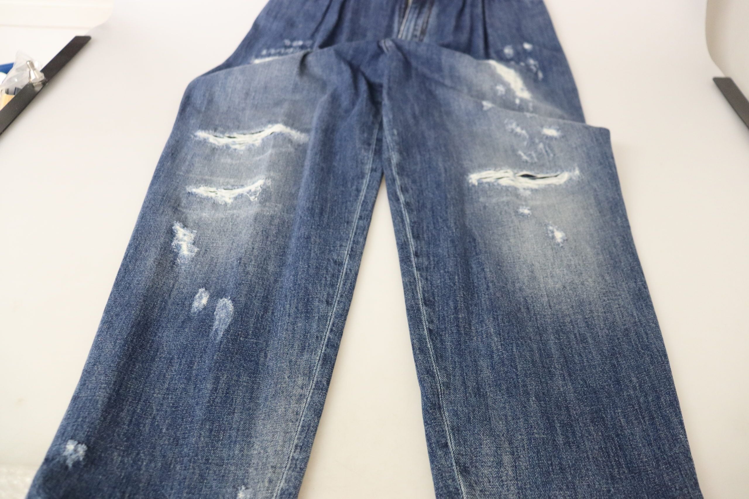 Blue washed high waist loose fit pants by Dolce & Gabbana, showcasing relaxed fit and stylish denim fabric.