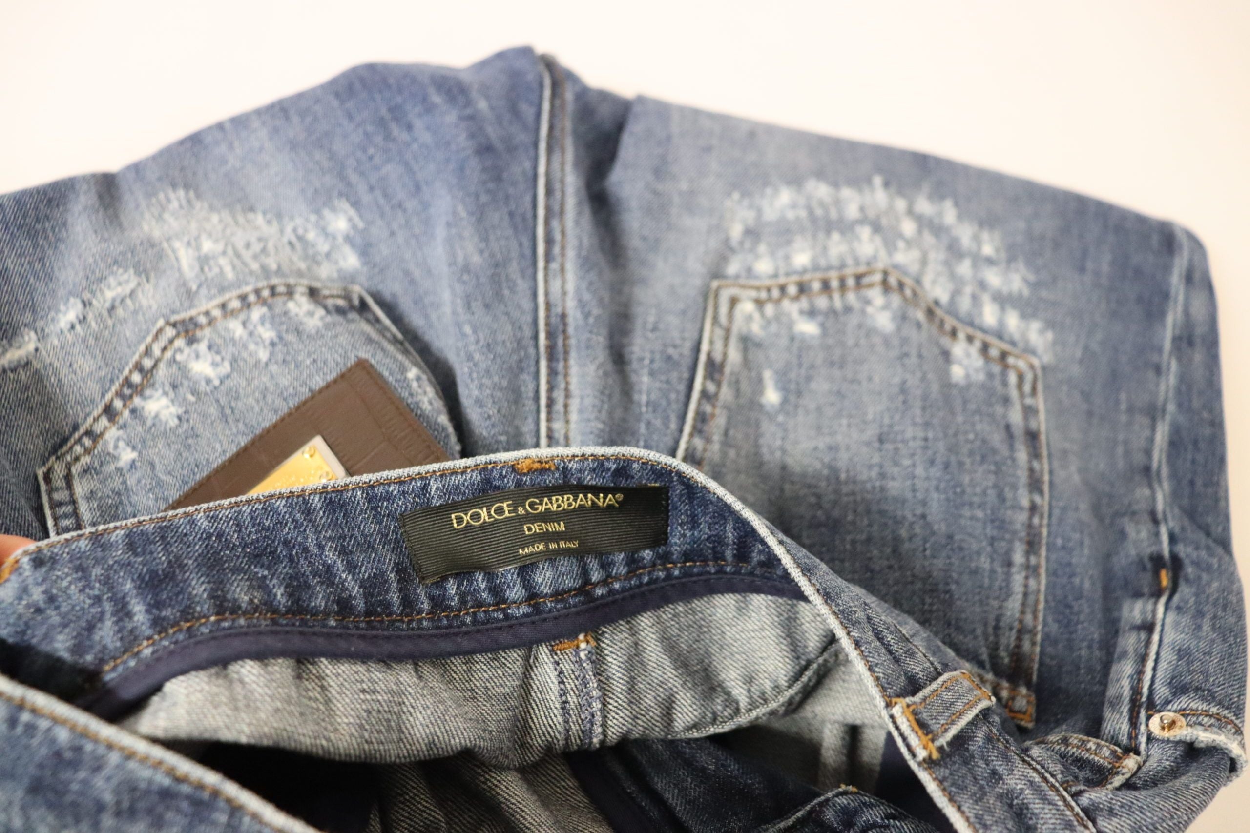Blue washed high waist loose fit pants by Dolce & Gabbana, shown in a relaxed fit style with a casual, stylish look.