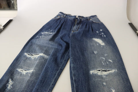 Blue washed high waist loose fit pants by Dolce & Gabbana, displayed on a hanger with a relaxed fit and casual style.