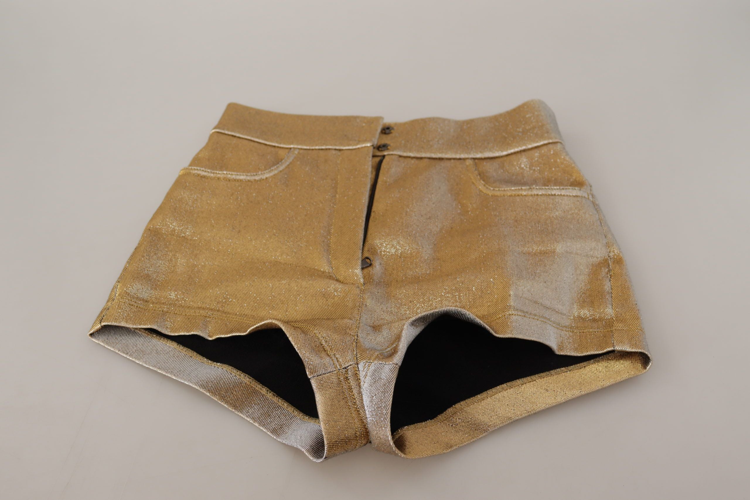 Gold cotton blend glittered hot shorts by Dolce & Gabbana, showcasing shiny fabric and stylish fit.