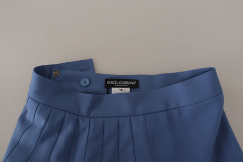 Blue embellished pleated mini wool skirt by Dolce & Gabbana, featuring intricate detailing and a structured fit.