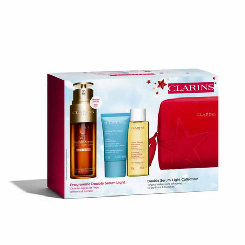Set of four Clarins Double Serum Light Texture 50ml bottles with elegant packaging, designed for skincare and hydration.