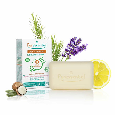 Puressentiel Pain Surgras Bio 100g soap bar with natural ingredients, shown in a close-up image.