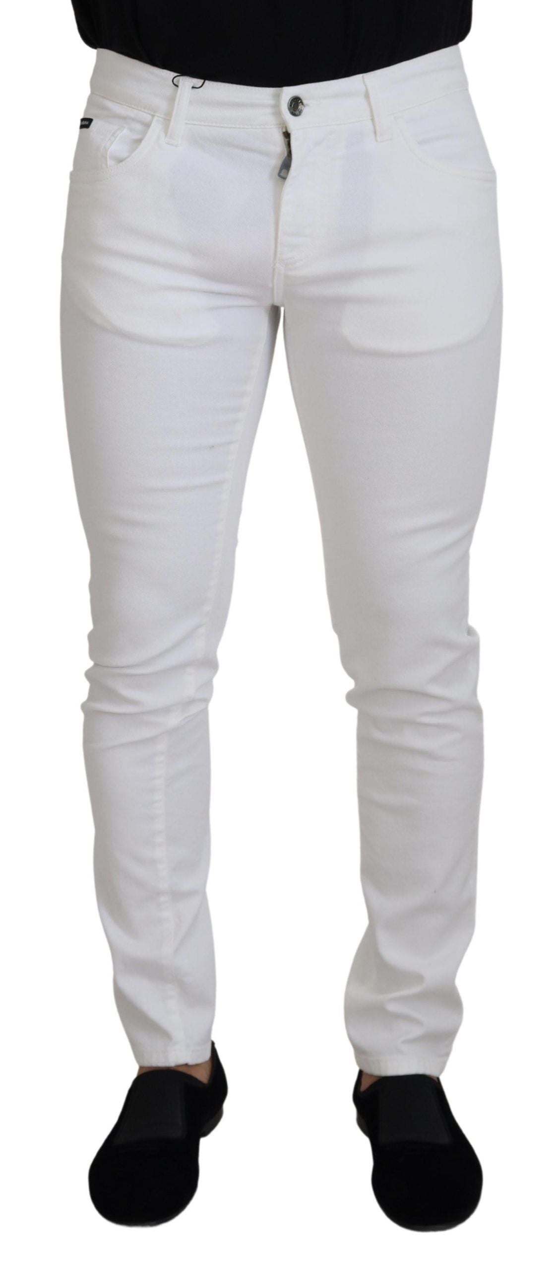 White slim skinny stretch cotton denim jeans by Dolce & Gabbana, showing a close-up of the fitted waist and leg details.