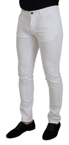 White slim skinny stretch cotton denim jeans by Dolce & Gabbana, showing the fitted design and classic five-pocket style.